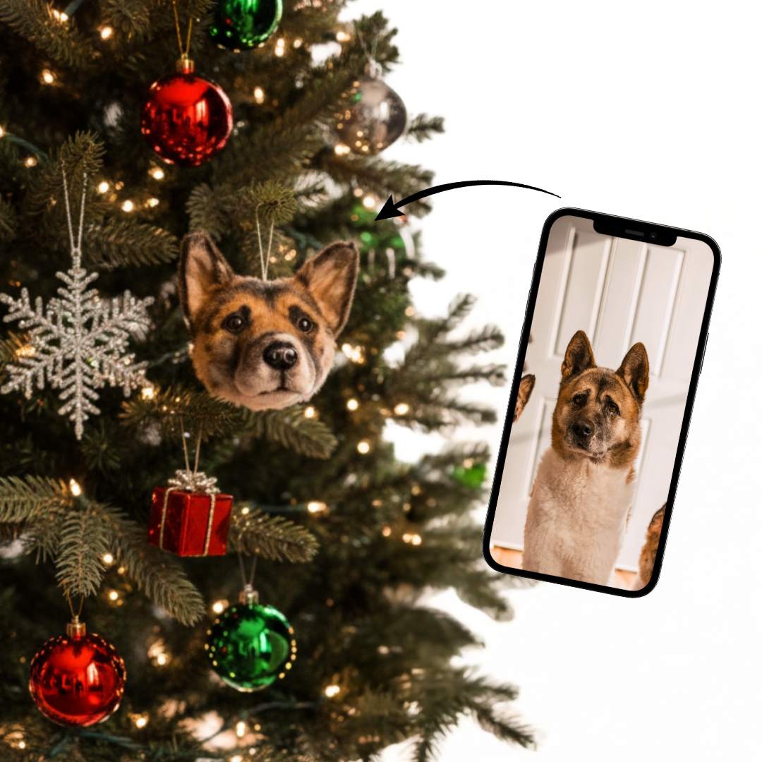 Dog-shaped ornament on a Christmas tree with a phone showing a photo of the same dog