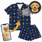 Navy blue pajama set with dog pattern and Wonder Woman logo, including a phone and inset of a dog.