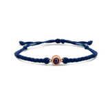 Navy blue braided bracelets with a black bead charm.