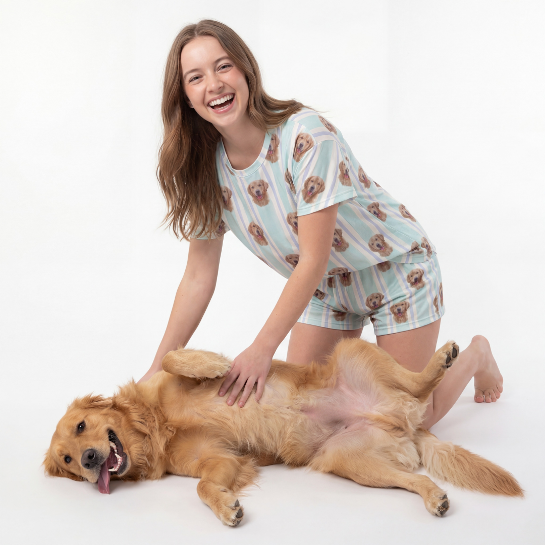 Woman in pajama set with dog on a white background