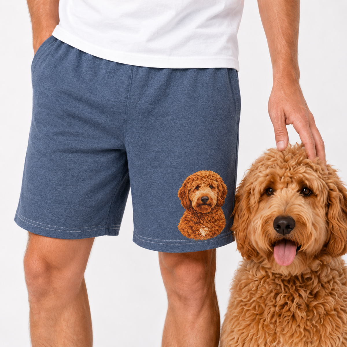 Person wearing navy shorts with a dog illustration, standing next to a real brown dog.