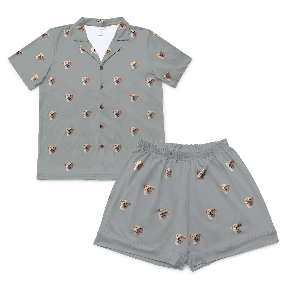 Slate grey short-sleeve pajama set with matching shorts, decorated with a repeating pattern of small dog faces.