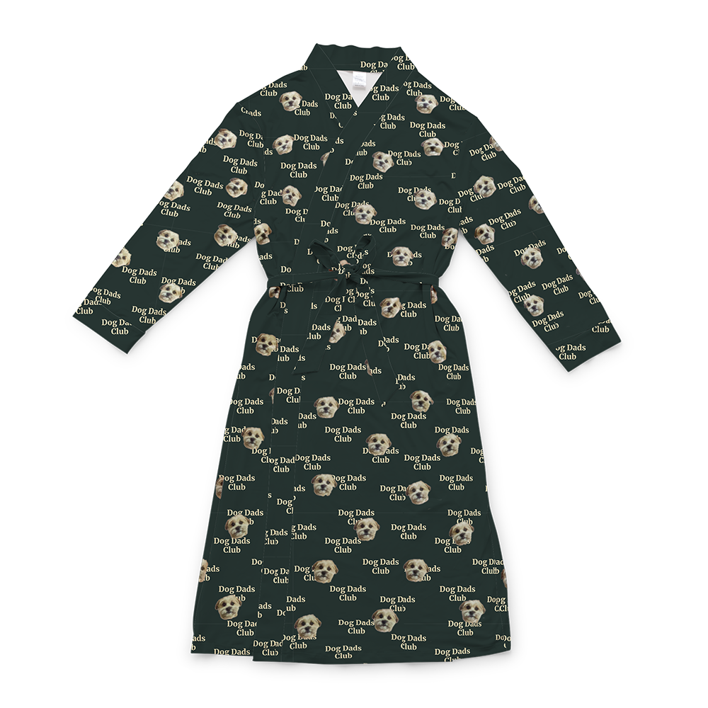 A dark green full-length robe with a tie belt, featuring a repeating custom pattern. The pattern includes several close-up photos of a small, light-colored dog's face, interspersed with the white text "Dog Dads Club" in a repeating diagonal pattern.