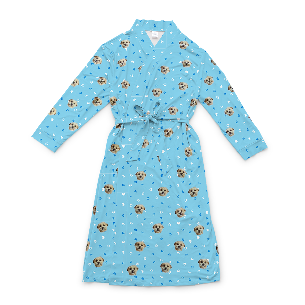 Light blue robe with a waist tie and an all-over print of small dog faces, shown on a white background