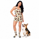 A woman modeling a sleeveless shirt and short set and matching socks with a vintage comic book cover print, standing next to a corgi on a white studio background.