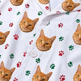 This is a close-up of the Christmas Paws print fabric on a button-down pajama shirt covered in repeating pet faces[ChristmasPawsPajamaFabricCloseUp]