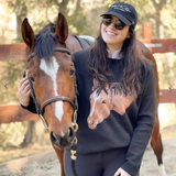 Woman with knit sweater with a horse face.
