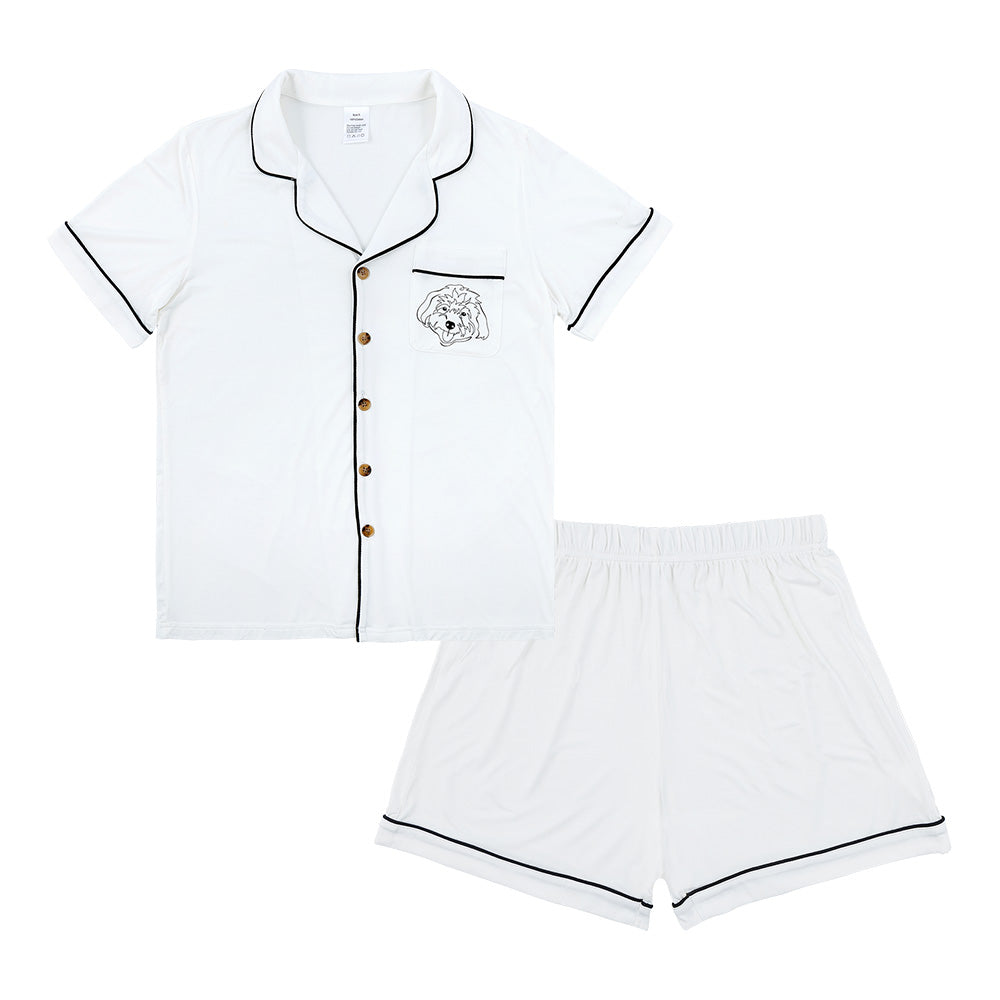 Premium women’s bamboo pajama set in ivory which contains a short sleeve shirt with buttons and a short pajama. Custom pet portrait on the chest pocket