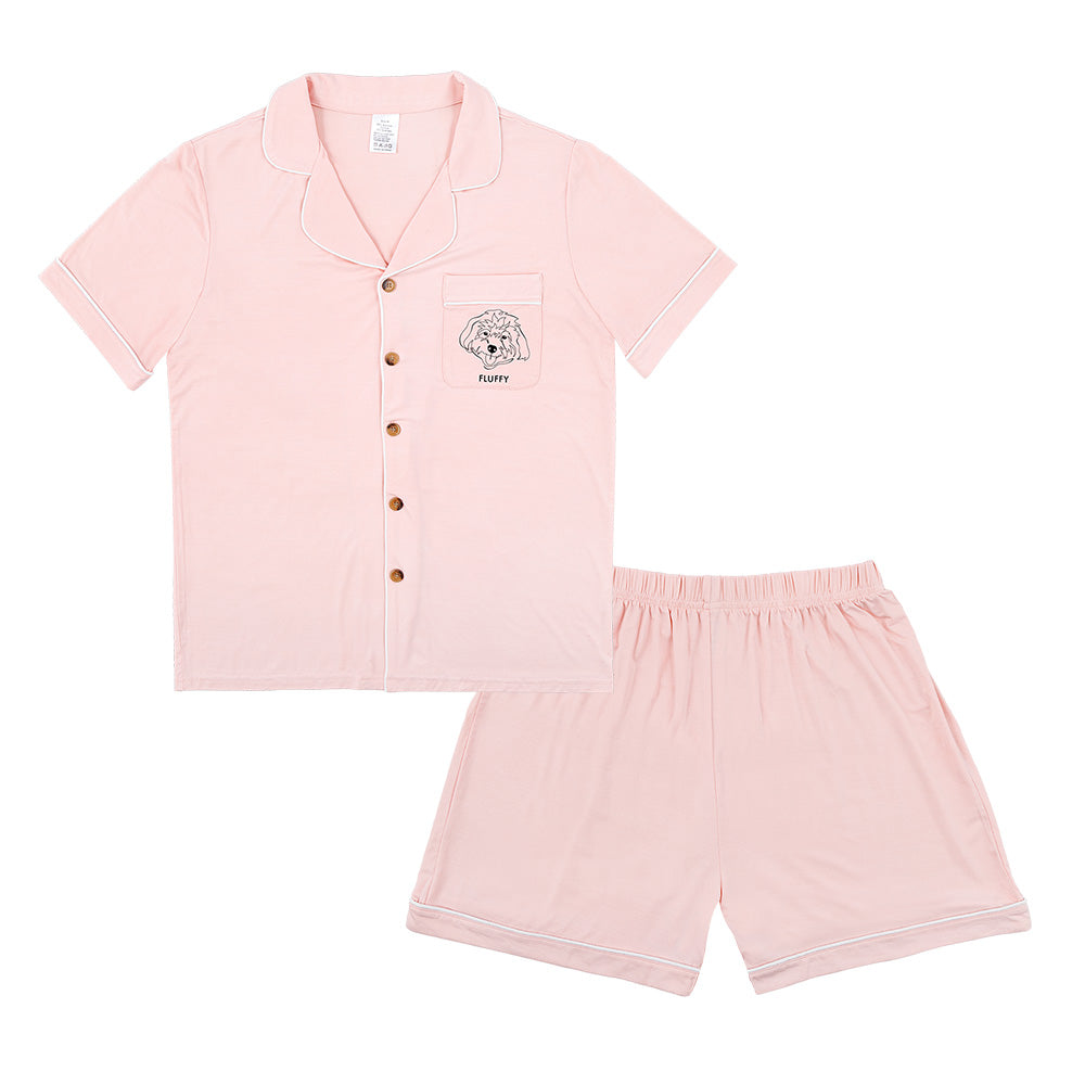 Premium women’s bamboo pajama set in light pink which contains a short sleeve shirt with buttons and a short pajama. Custom pet portrait on the chest pocket