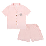 Premium women’s bamboo pajama set in light pink which contains a short sleeve shirt with buttons and a short pajama. Custom pet portrait on the chest pocket