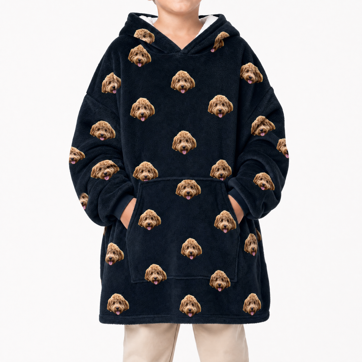 Black blanket hoodie with dog face pattern worn by a person on a white background