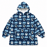 A navy blue hooded jacket with an all-over festive print featuring the text 'Frosty Strikes Back' in light blue, white snowflakes, and circular dog portraits. The jacket is displayed flat against a solid white background.