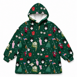 A dark green pullover hoodie featuring an all-over Christmas-themed print with black-and-white cats, Santa Claus figures, red hot dogs, Christmas trees, houses, and snowflakes, shown on a plain white background.