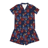 Children's pajama set with superhero-themed dog print on a blue background