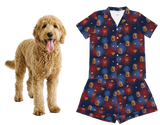 Dog next to a blue pajama set with red and white pattern on a white background