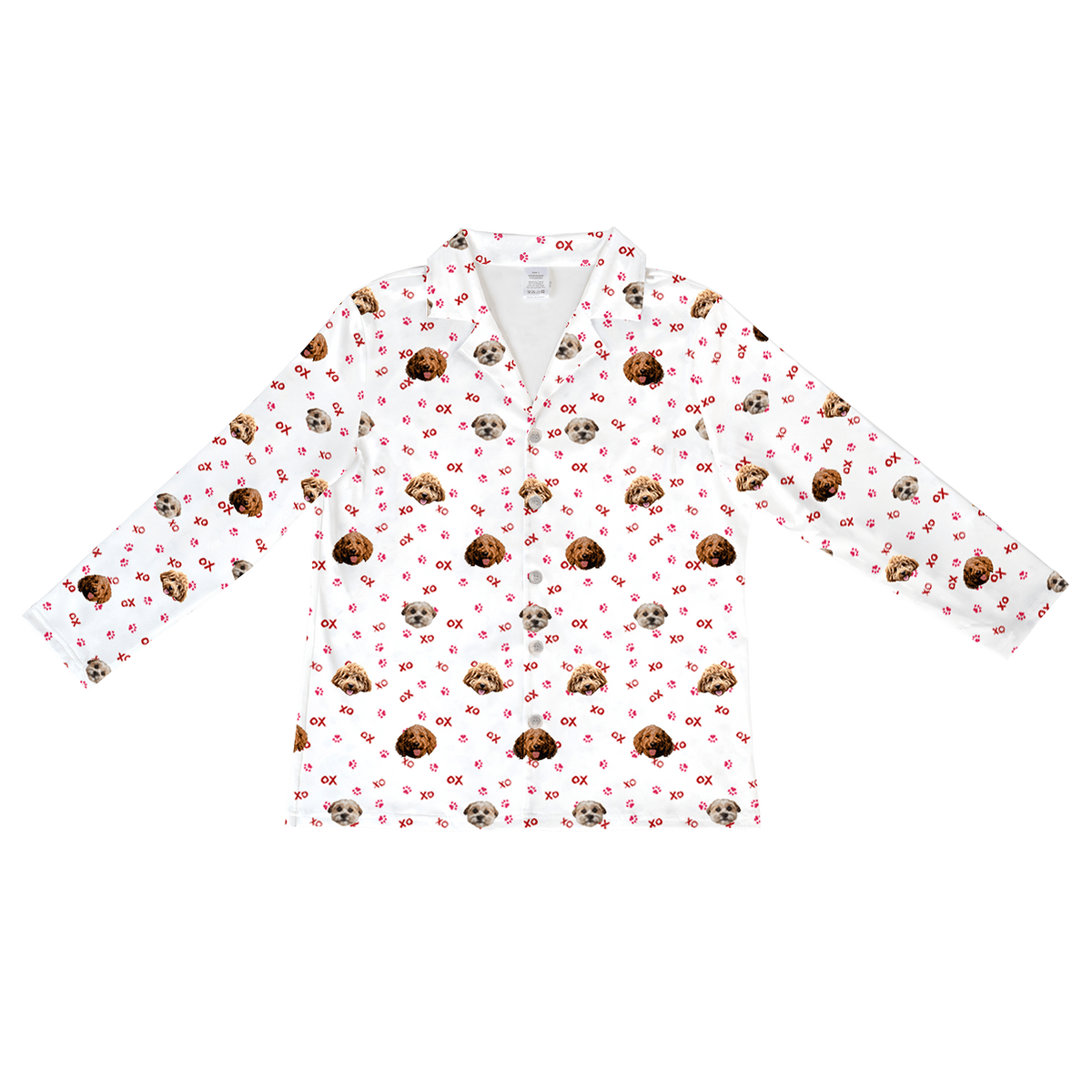 
A white, long-sleeve, button-down pajama top featuring a repeating pattern of three different dog faces, each with a light to reddish-brown coat. The pattern also incorporates small pink "XO" text and scattered pink paw prints.