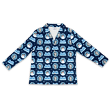A long-sleeve collared shirt with a navy blue background and an all-over repeating print of cartoon dog characters in winter hats and the text 'Just Dog'.