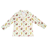 A long-sleeve button-front shirt with a festive holiday print featuring brown teddy bears, Santa hats, hot chocolate cups, and cherries on an off-white background.