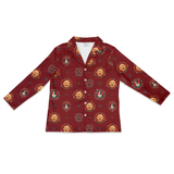 A long-sleeve button-up shirt in deep burgundy with an all-over print of golden retriever dog faces in circular frames, displayed flat against a white background.