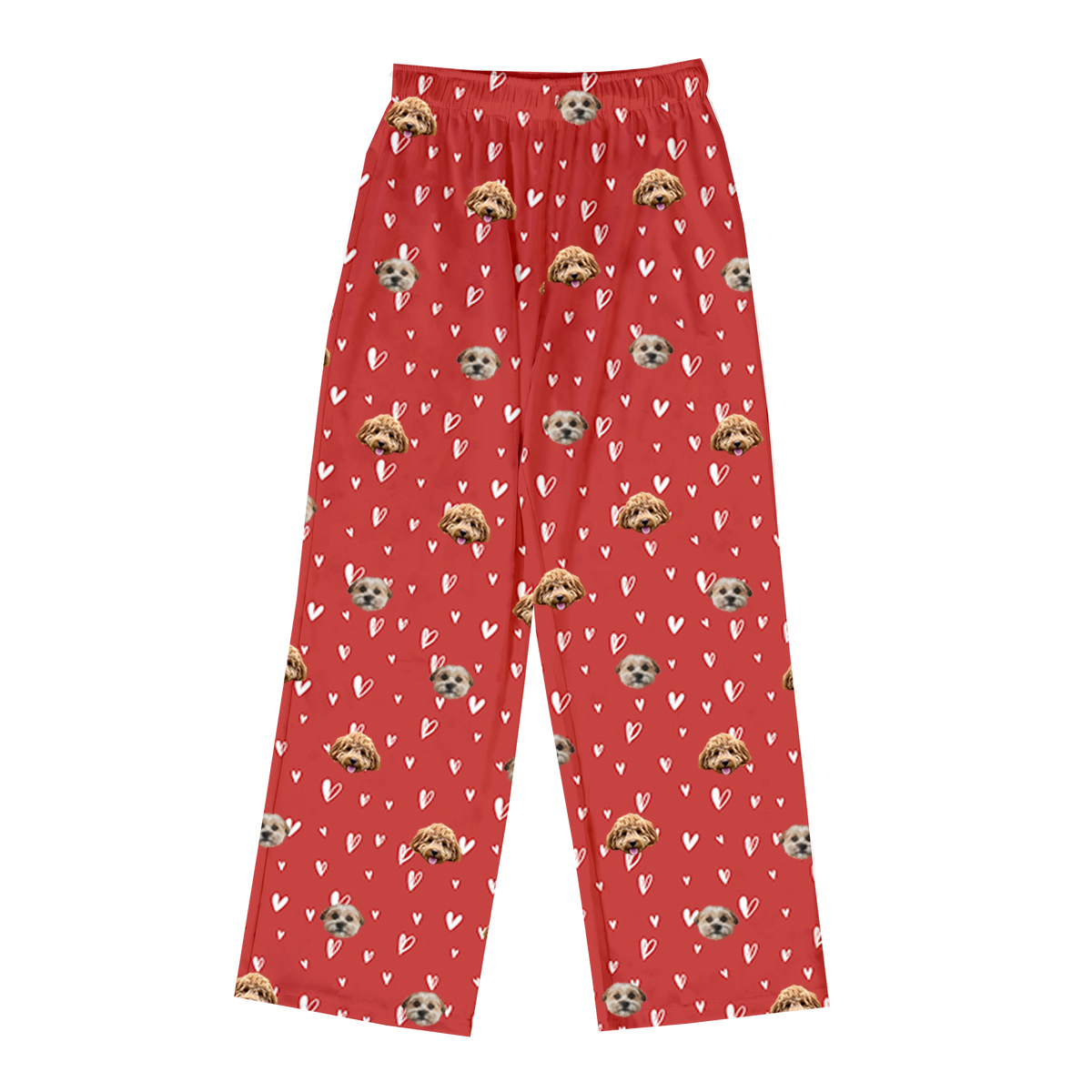 Red pajama pants patterned with white hearts and the custom photo heads of two different dogs.