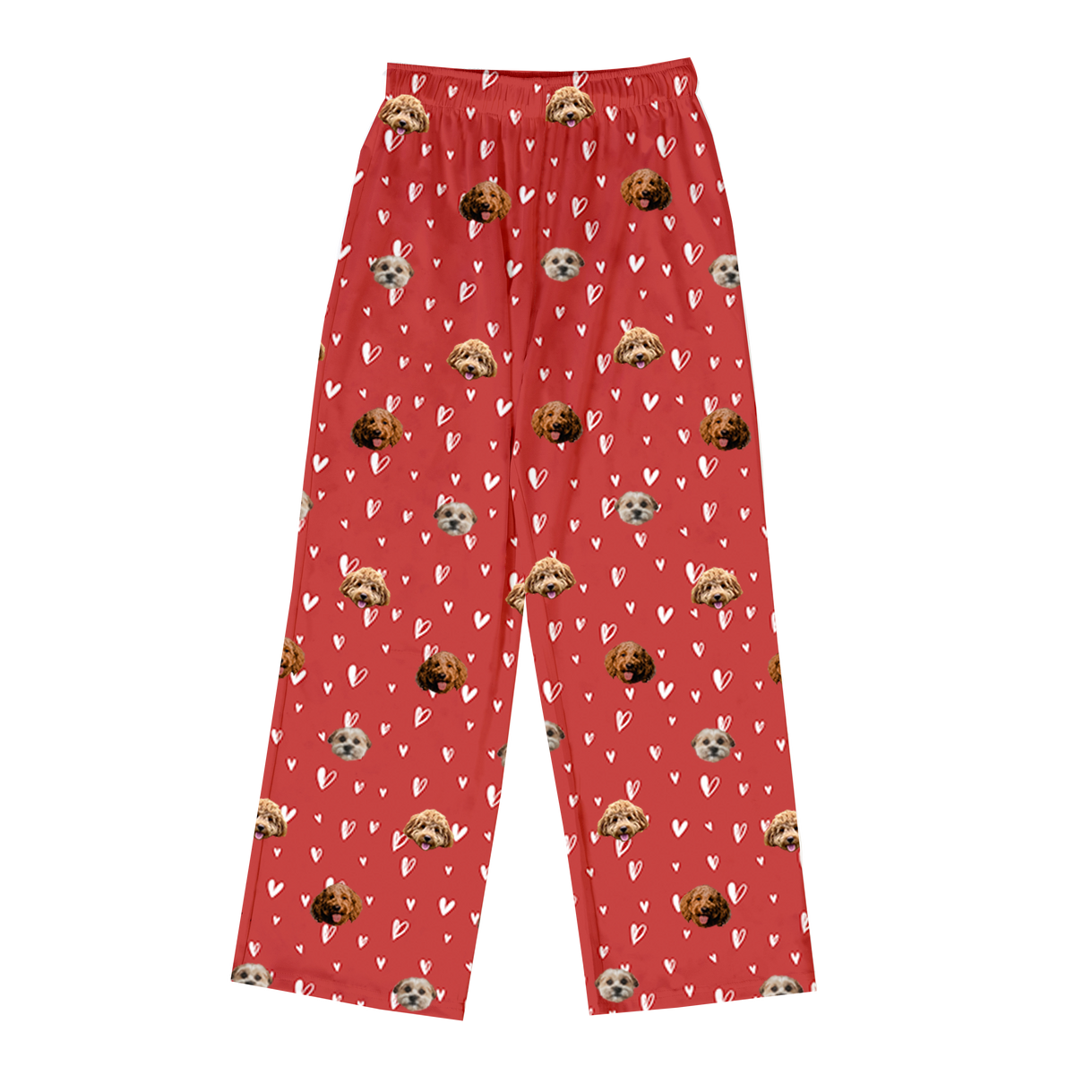 A single pair of full-length pajama pants in a vibrant red color. The fabric has an all-over pattern of scattered white line-art and solid hearts. Overlaid on this pattern are repeating, cropped dog faces.