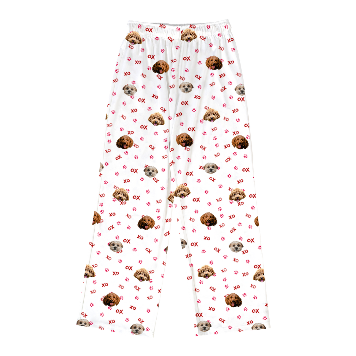 White pajama pants with a straight-leg fit and elastic waistband, featuring an all-over print of multiple dog faces, red paw prints, and red “XO” lettering.