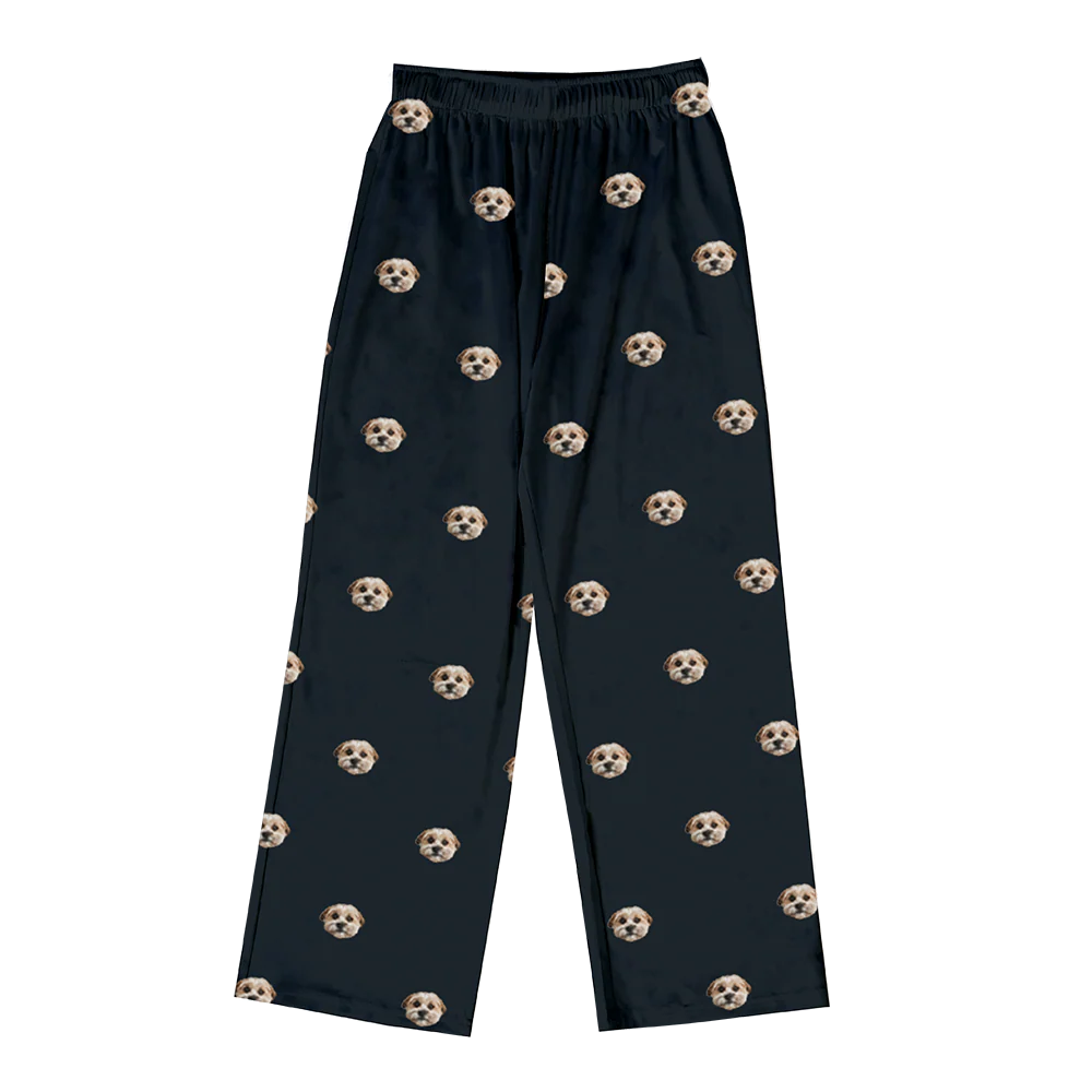 Black pants with dog patterns on a white background