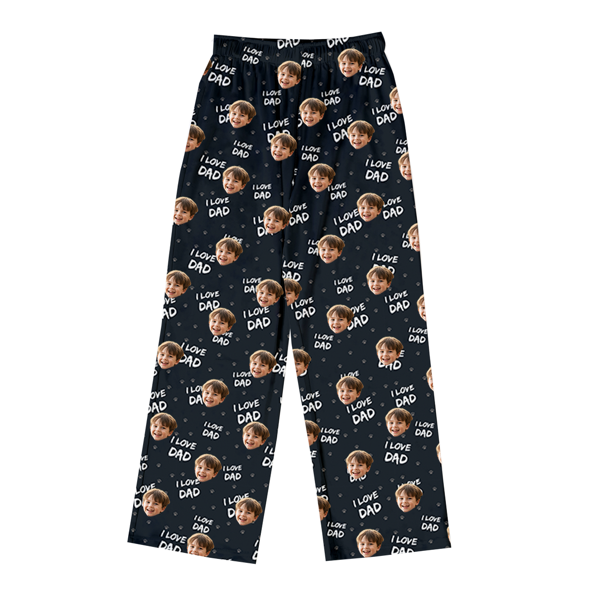 Black pajama pants featuring a repeating pattern of a smiling child’s face along with the phrase “I LOVE DAD” scattered across the fabric.