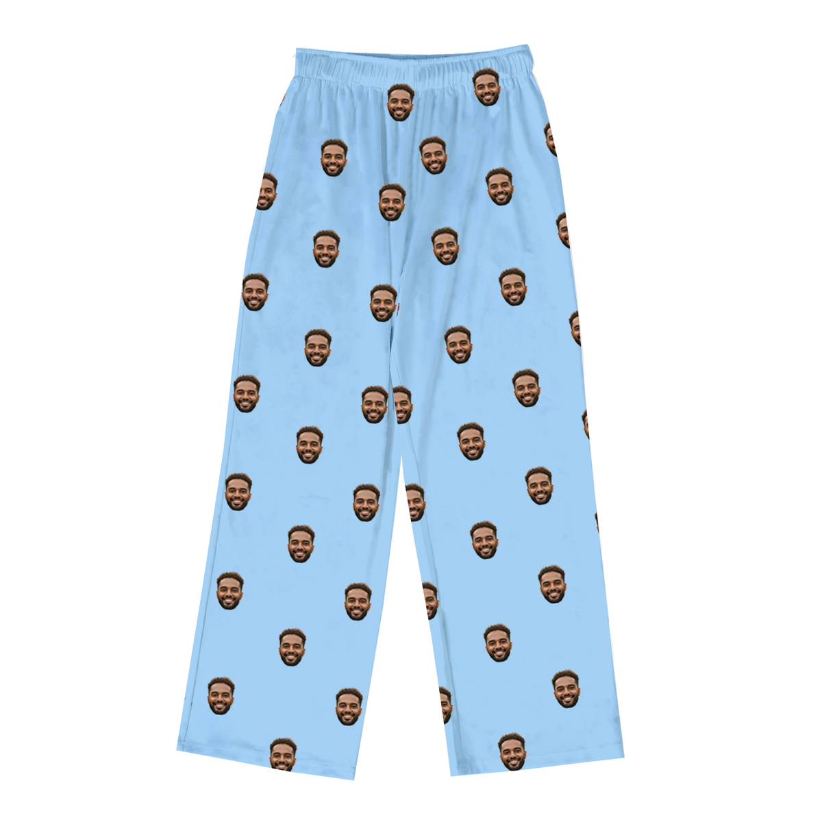 Light blue pajama pants featuring a repeating pattern of the same smiling man’s face printed across the fabric.