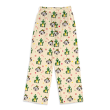 A pair of cream-colored pajama pants featuring an all-over print of cactus pets wearing green Santa hats, with small red and green holiday accents, shown against a plain white background.