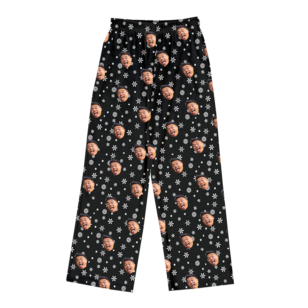 A pair of full-length pajama pants in a solid black color. The pants are customized with a repeating pattern of white snowflakes and small white dots, along with small, repeating images of a man's face with a wide-open, laughing expression.