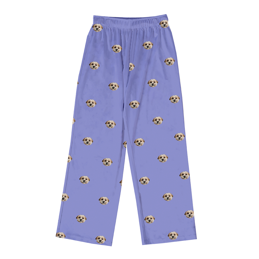 Personalized pajama pants in a periwinkle color, featuring a repeating pattern of the face of a single, small tan and white dog.