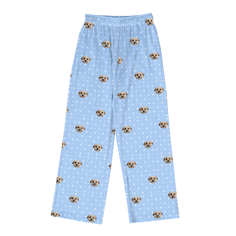 These are pajama pants in a snowflakes print with repeating pet faces on them[Snowflakes]