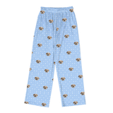 These are pajama pants in a snowflakes print with repeating pet faces on them[Snowflakes]