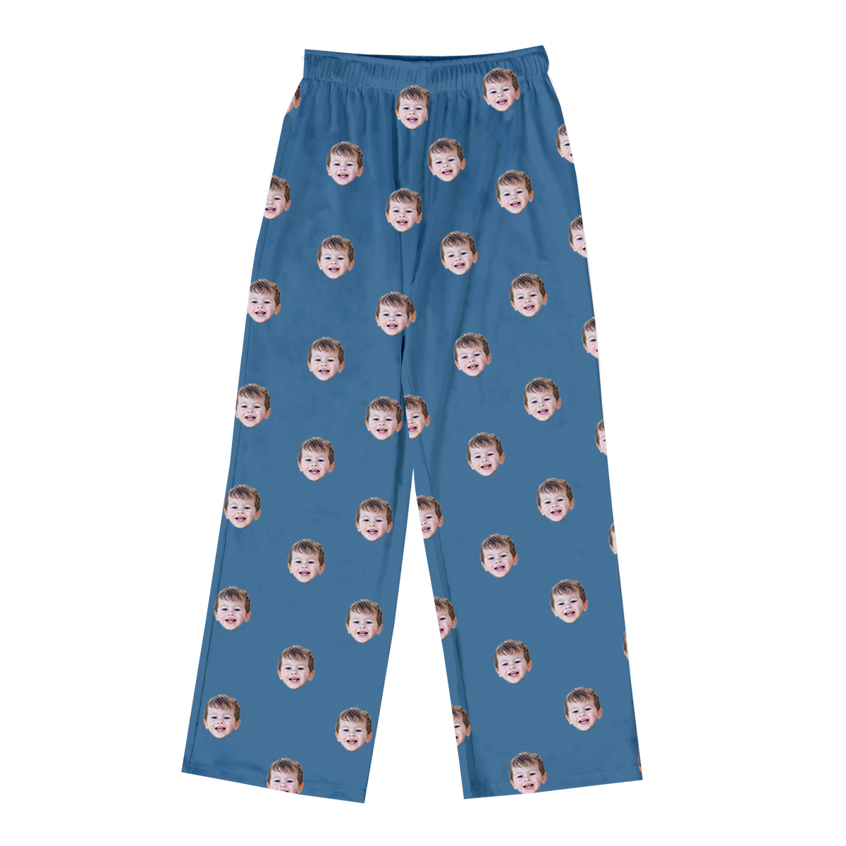 Blue pajama pants featuring a repeating pattern of the same smiling child’s face printed across the fabric.