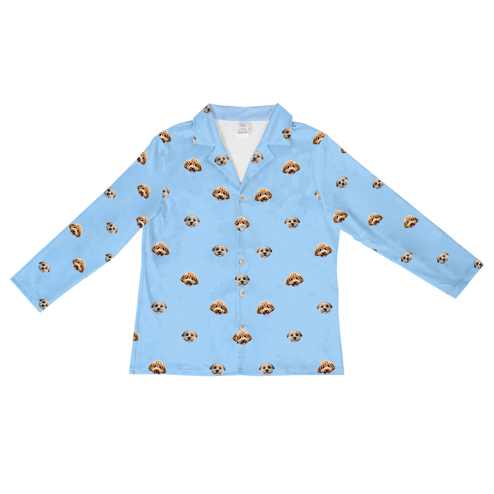 Sky-blue long-sleeve button-down pajama top featuring a repeating pattern of two different dog faces across the fabric.