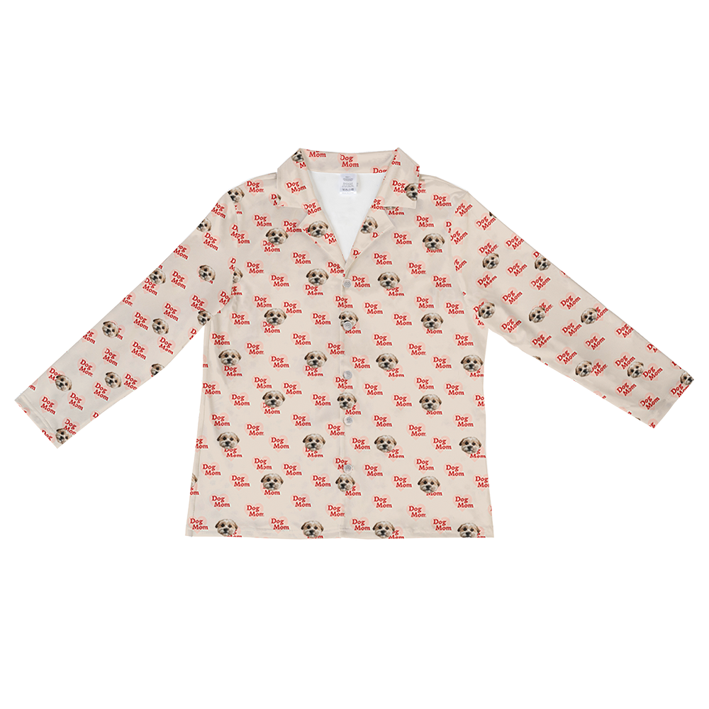 Beige long-sleeve button-down pajama top with an all-over pattern of small dog faces and red ‘Dog Mom’ text.