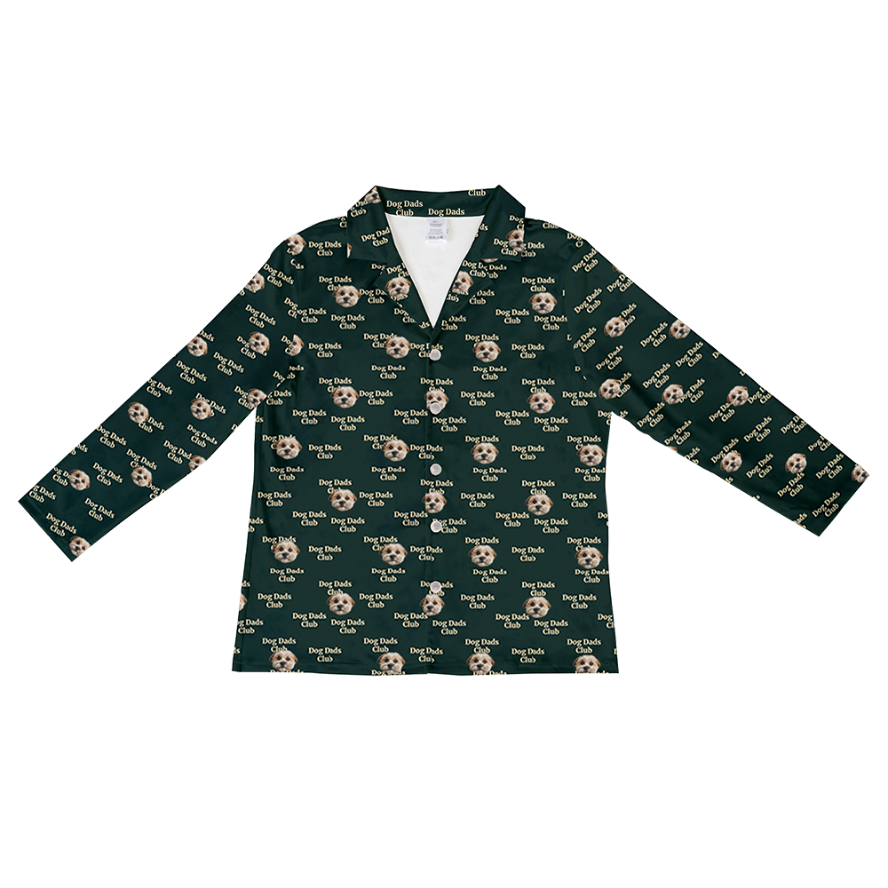 Long-sleeve hunter green button-down pajama top with an all-over pattern of small dog faces and white ‘Dog Dads Club’.