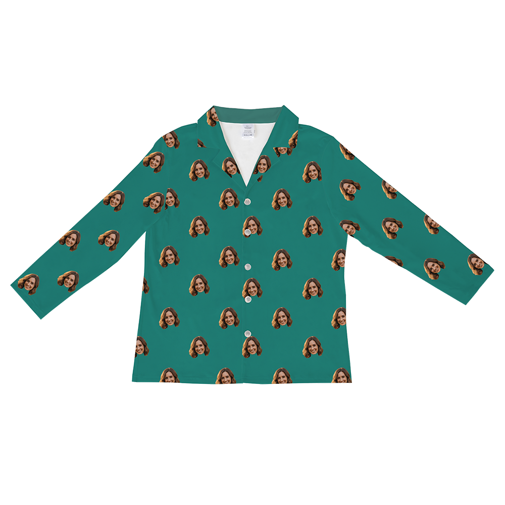 Long-sleeved, button-down pajama shirt in a solid teal green color, featuring a repeating pattern of a smiling woman's face with brown hair.