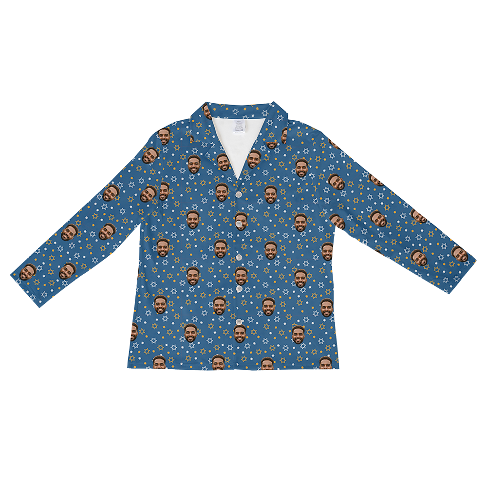 Long-sleeved, button-down pajama shirt in royal blue with a festive pattern of a man's face, yellow and white Stars of David, and small gold and white dots, suitable for a Hanukkah or holiday theme.