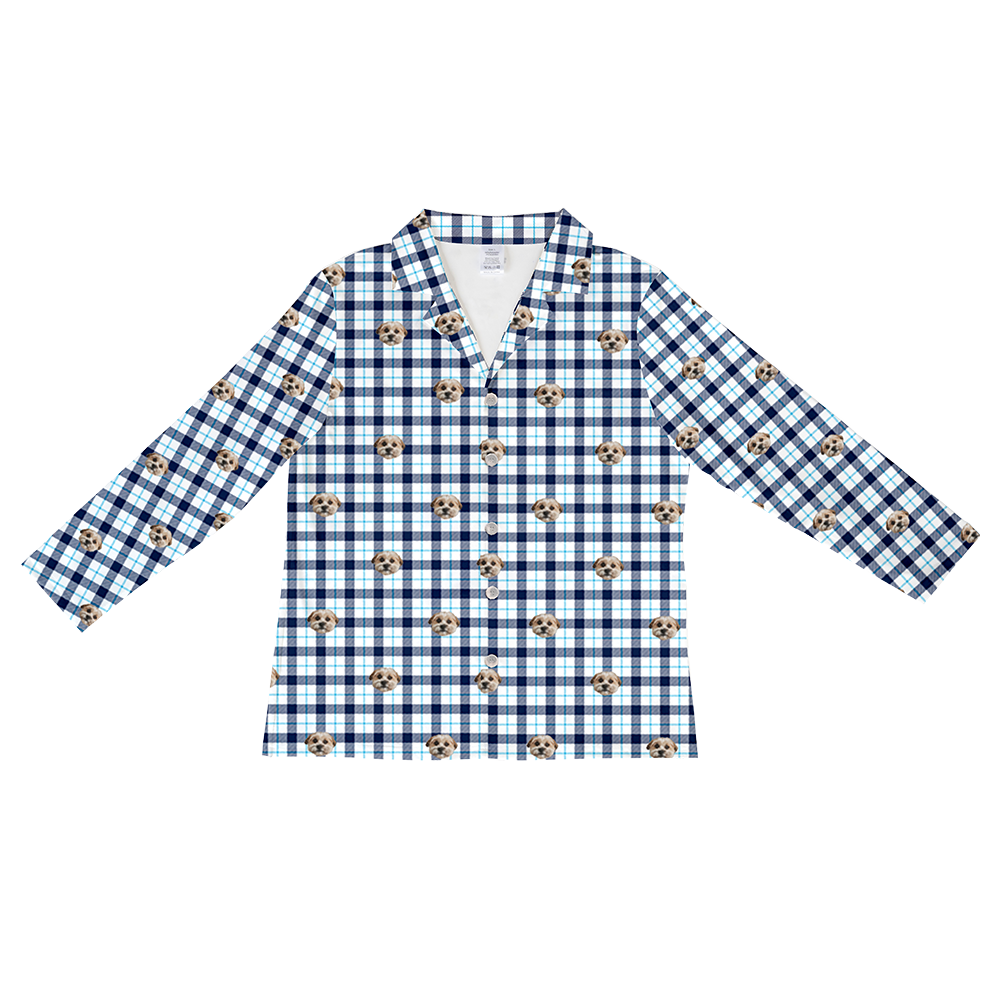 Long-sleeve, button-down pajama top in a navy blue, light blue, and white plaid pattern featuring multiple dog faces.