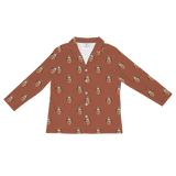 Burnt orange long-sleeve button-down pajama shirt with repeating prints of a smiling crowned woman[CocoaLongSleevePajamaShirt]