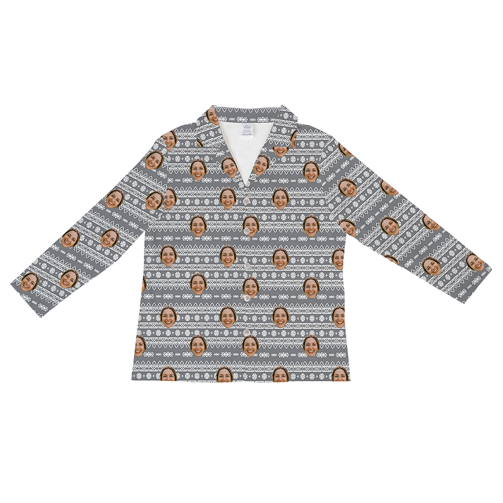 Long-sleeved, button-down pajama shirt in gray, featuring a repeating white Fair Isle or ugly holiday sweater knit pattern overlaid with a pattern of a smiling woman's face.