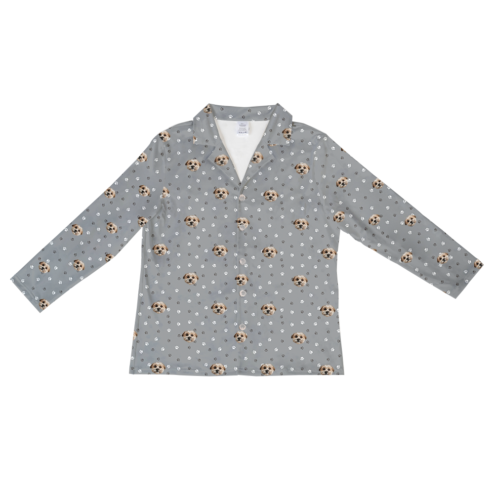 Slate gray long-sleeve pajama top with an all-over pattern of small dog faces and white and gray paw prints, shown flat on a white background.