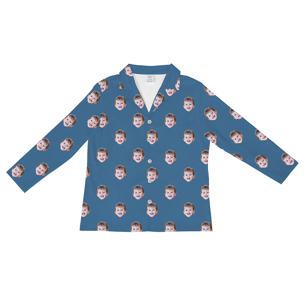 Long-sleeved, button-down pajama shirt in a solid dusty blue color, featuring a repeating pattern of a young boy's smiling face.