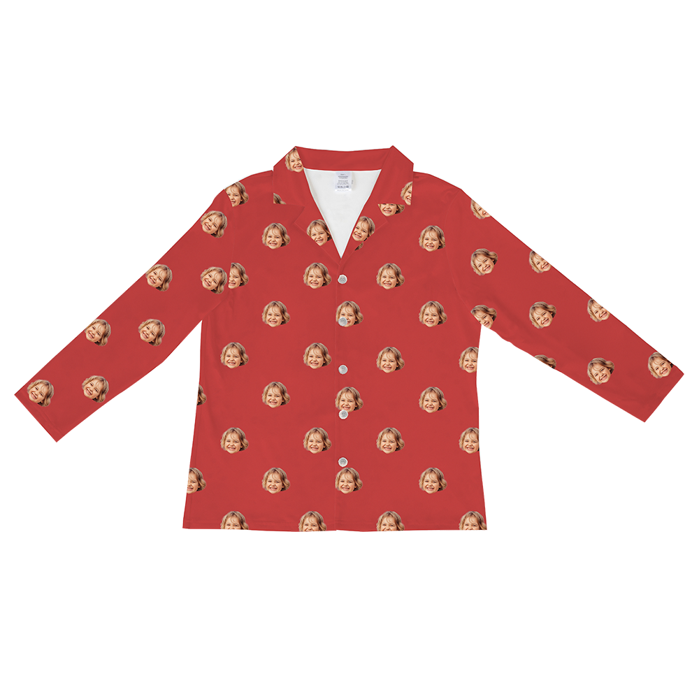 Long-sleeved, button-down pajama shirt in a solid bright red color, featuring a repeating pattern of a smiling woman's face with light brown hair.
