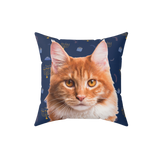 Pillow with a cat's face on a blue background with Hannukah items.