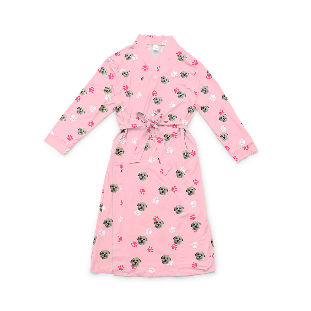 Pink robe with a waist tie and an all-over print of small dog faces, shown on a white background