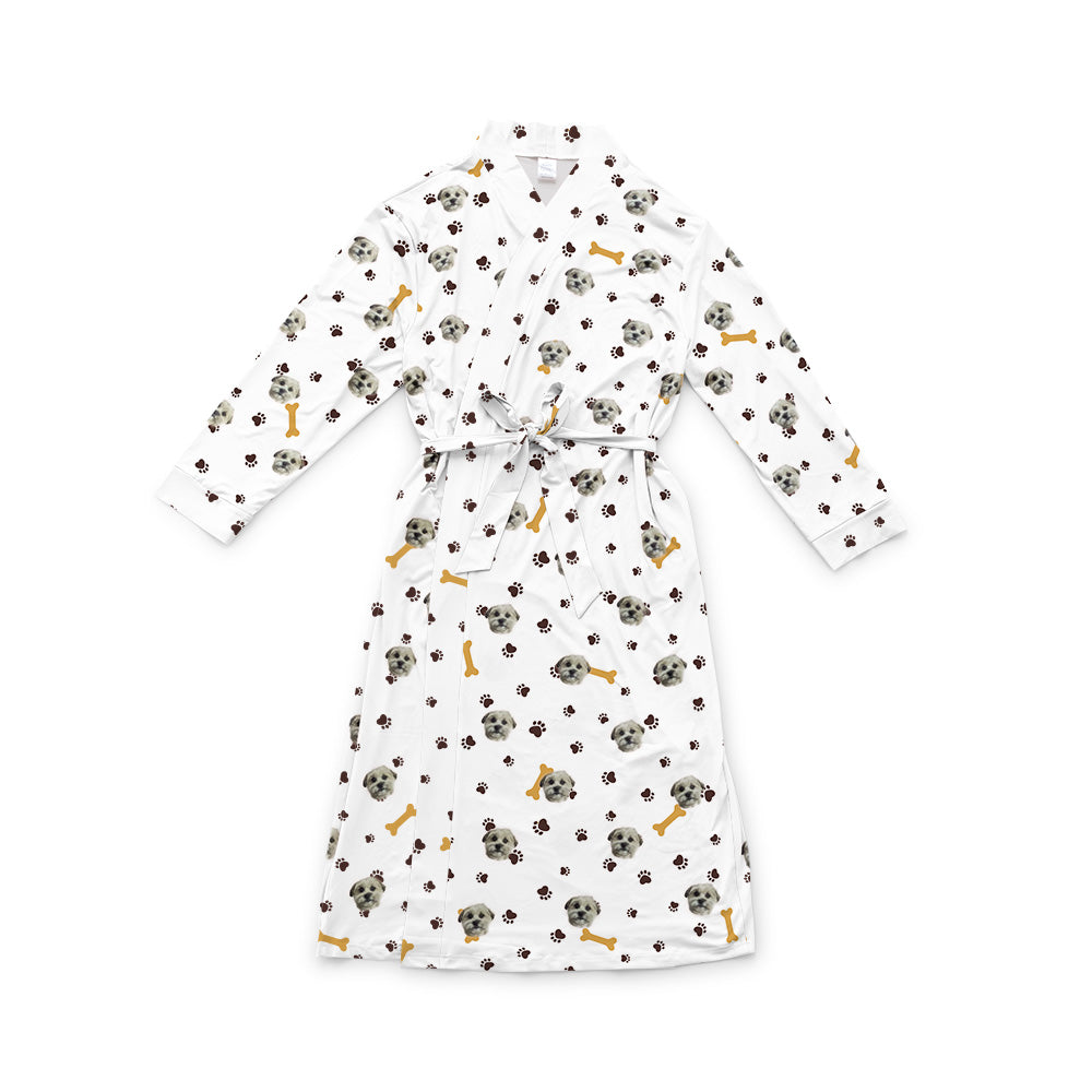 White robe with a waist tie and an all-over print of small dog faces, shown on a white background