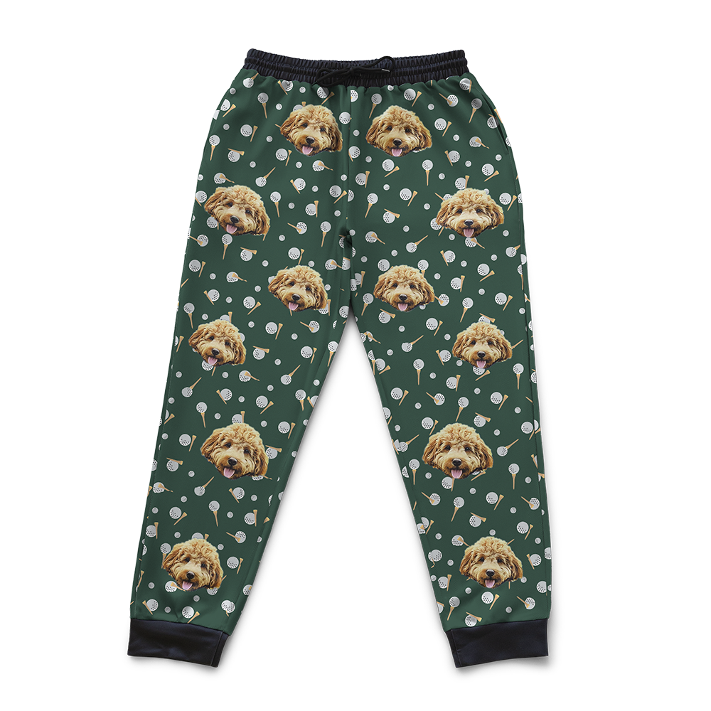 Green sweatpants with a repeating pattern of a dog’s face, scattered white golf balls.